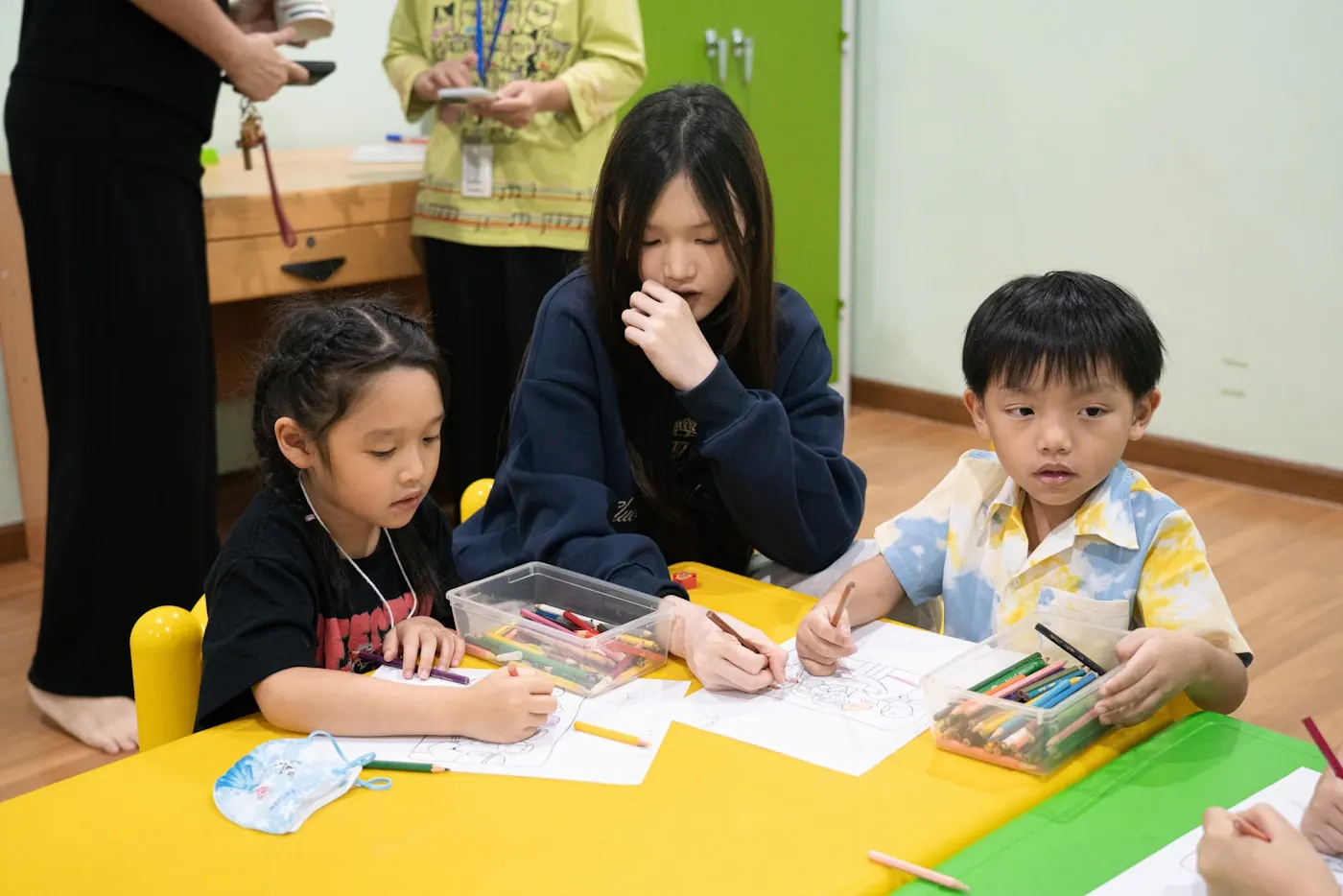 A practitioner and children working together at the centre
